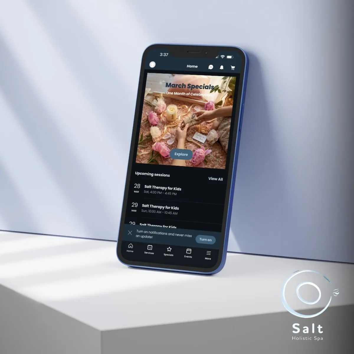 The Salt Holistic Spa app on a phone, showing specials and upcoming sessions